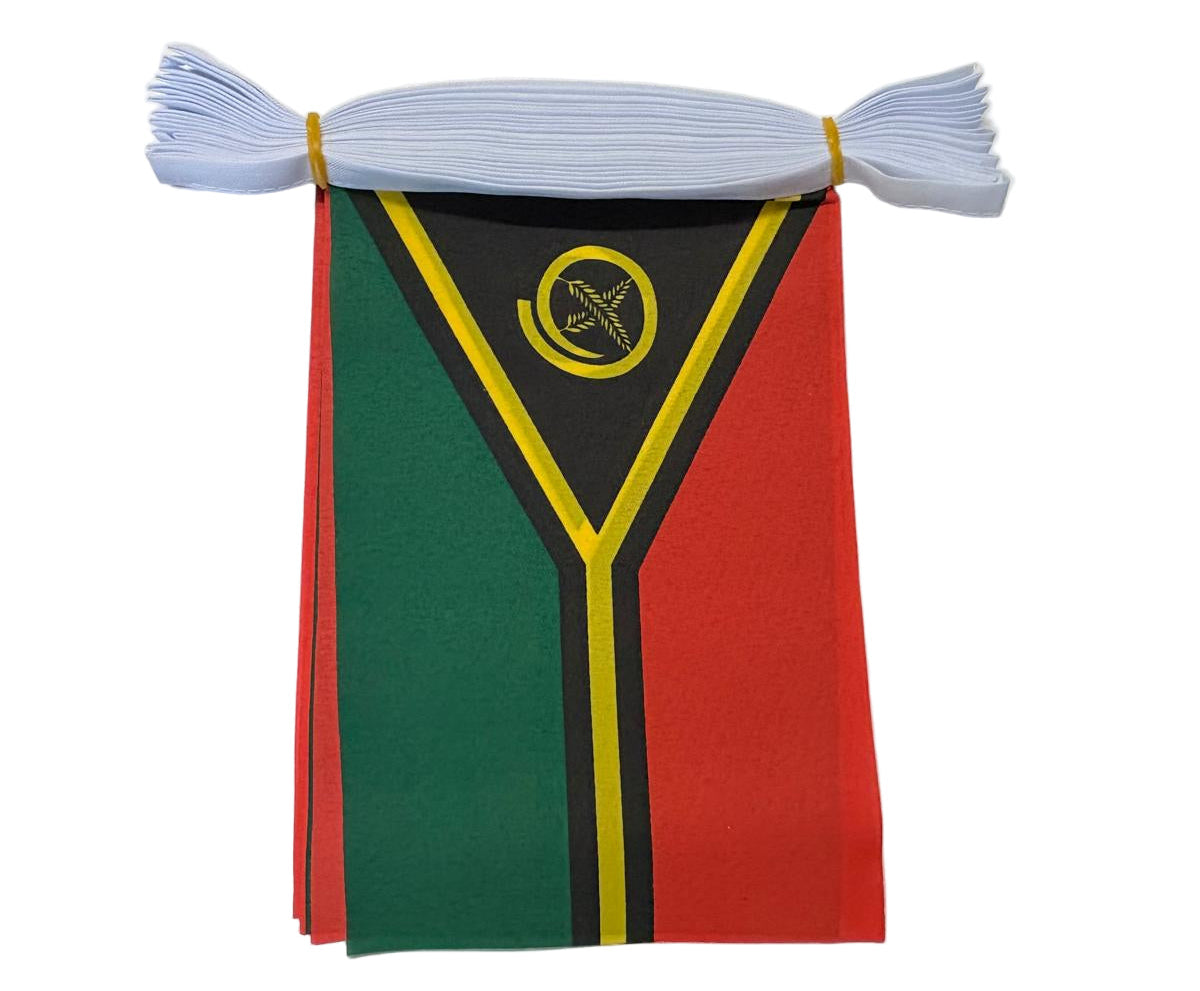 Small flag with green, red, and black design on a white string