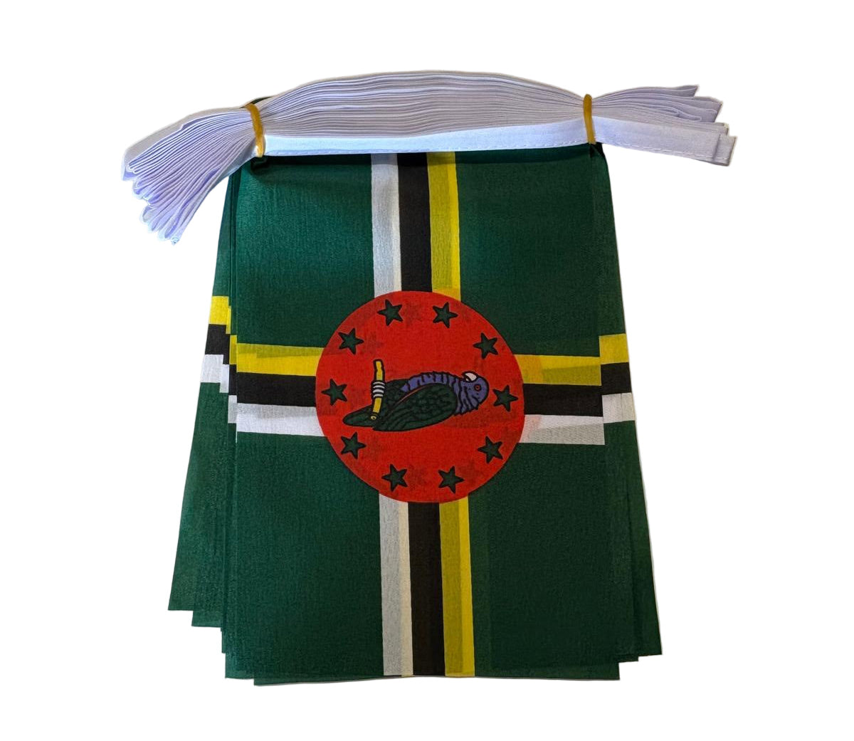 Small flag with a red circle and black emblem on a green background, attached to a white string