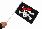 Pirate flag with skull and crossbones design held by a hand on a white background