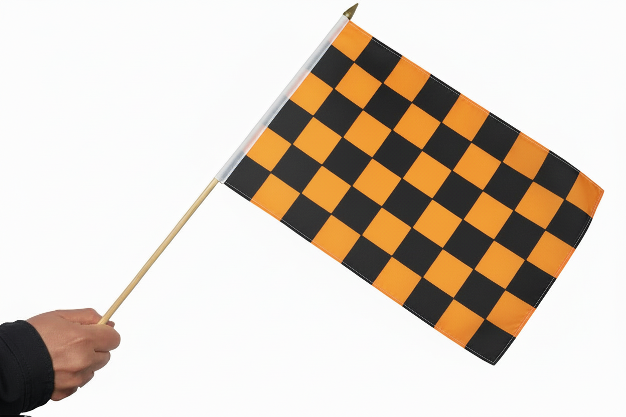 Checkered flag with black and orange pattern held by a hand on a white background